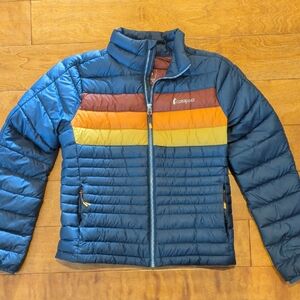 Cotopaxi Navy Jacket with Colorful Stripes